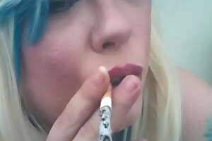 A Blonde BBW Mistress Tina Snua Smoking A Cork Cigarette Regarding Drifts