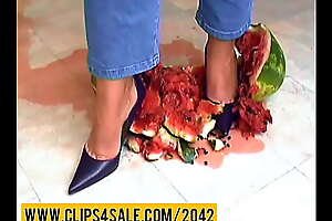 Watermelon crushing under high heels