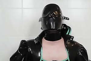 Spitting diversion with latex mask and costume - Saliva no-see-em on shiny rubber apparel (TRAILER)
