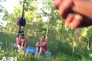 The guy crazily jerks off on two girls in the forest