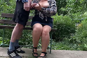 Big cock cumshot on her tits in the park on a bench