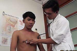 Asian doctor inspecting twinks butt