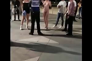 fully naked woman fighting with police officer