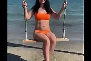 Sexy Petite Woman on Swing, right after BDSM Orgasm in Sea