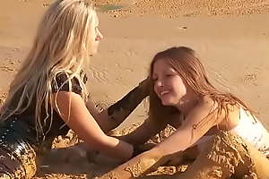 2 girls have fun up mud
