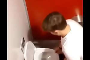 Spying guy jerking elsewhere in public restroom