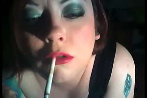 BBW Tina Snua Smokes 2 120 Cigarettes With Dangles and  Holding About Smoke