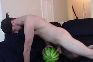 Brad Borrelli Shoves His Big White Flannel In a Watermelon